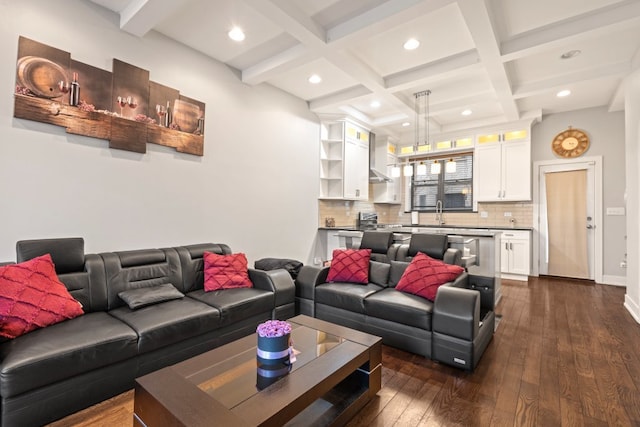 living area featuring coffered ceiling, dark wood finished floors, beamed ceiling, and recessed lighting