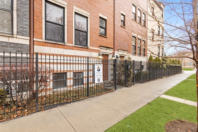 view of property with fence