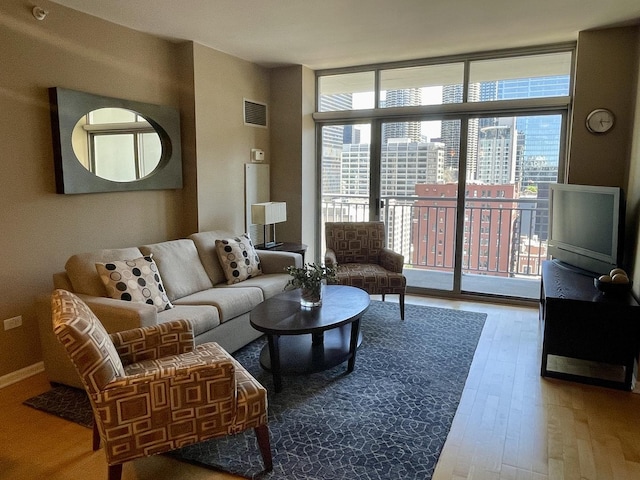 600 N Dearborn St Unit 1804, Chicago, IL 60654 - living room with visible vents, wood finished floors, and a wall of windows