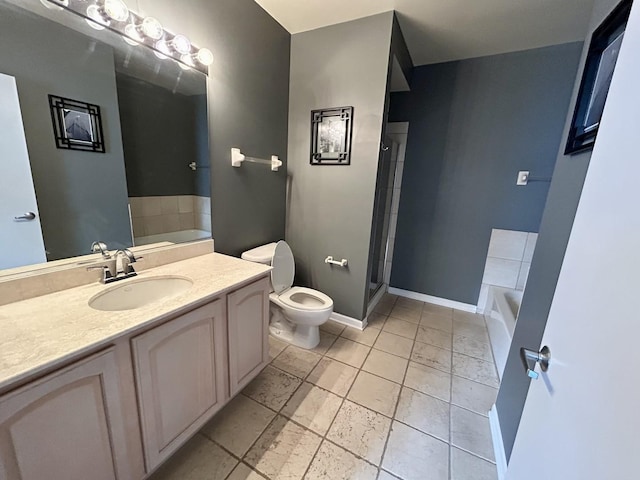 600 N Dearborn St Unit 1804, Chicago, IL 60654 - bathroom featuring baseboards, toilet, vanity, a stall shower, and a garden tub