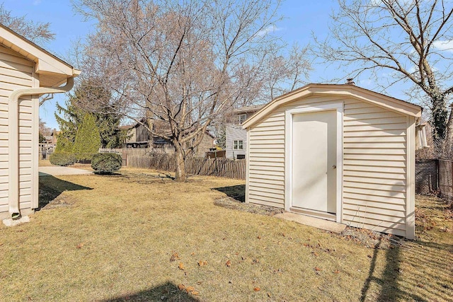 view of shed with a fenced backyard