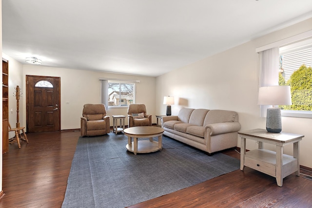 living room featuring dark wood finished floors and baseboards