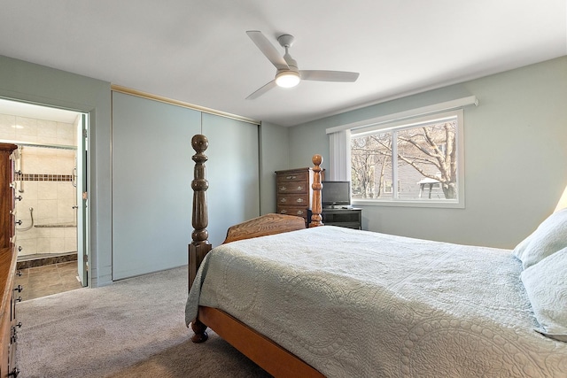 bedroom with a closet, carpet flooring, ensuite bathroom, and ceiling fan