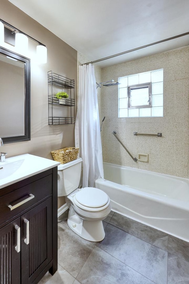 bathroom featuring tile patterned flooring, toilet, vanity, and shower / bath combo