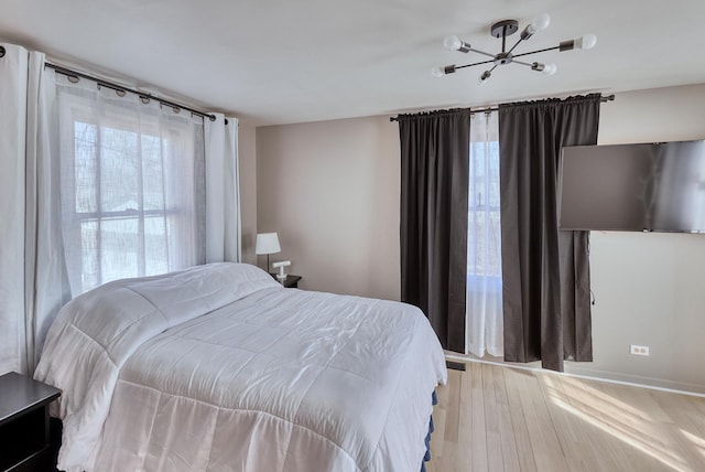 bedroom with light wood-style floors