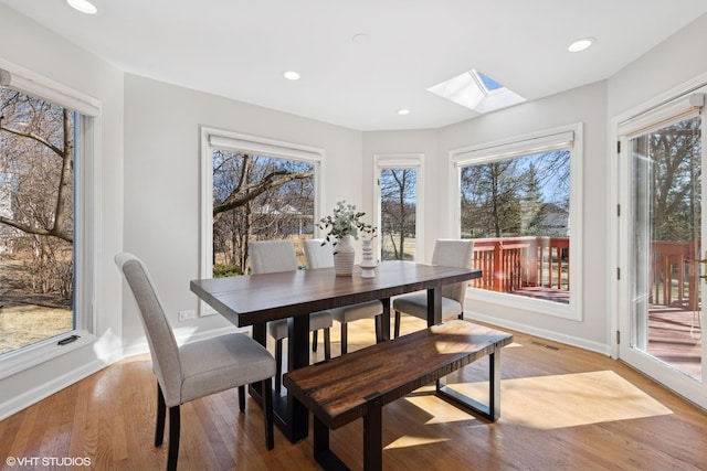 dining area featuring recessed lighting, a healthy amount of sunlight, and light wood-type flooring