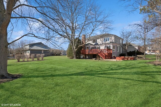 view of yard with a deck