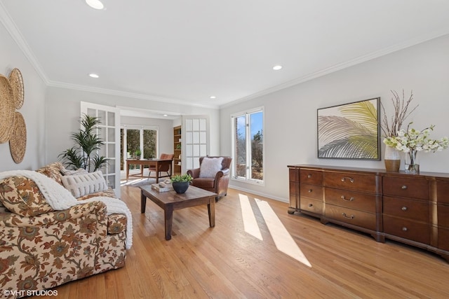 living area with crown molding, recessed lighting, and light wood finished floors