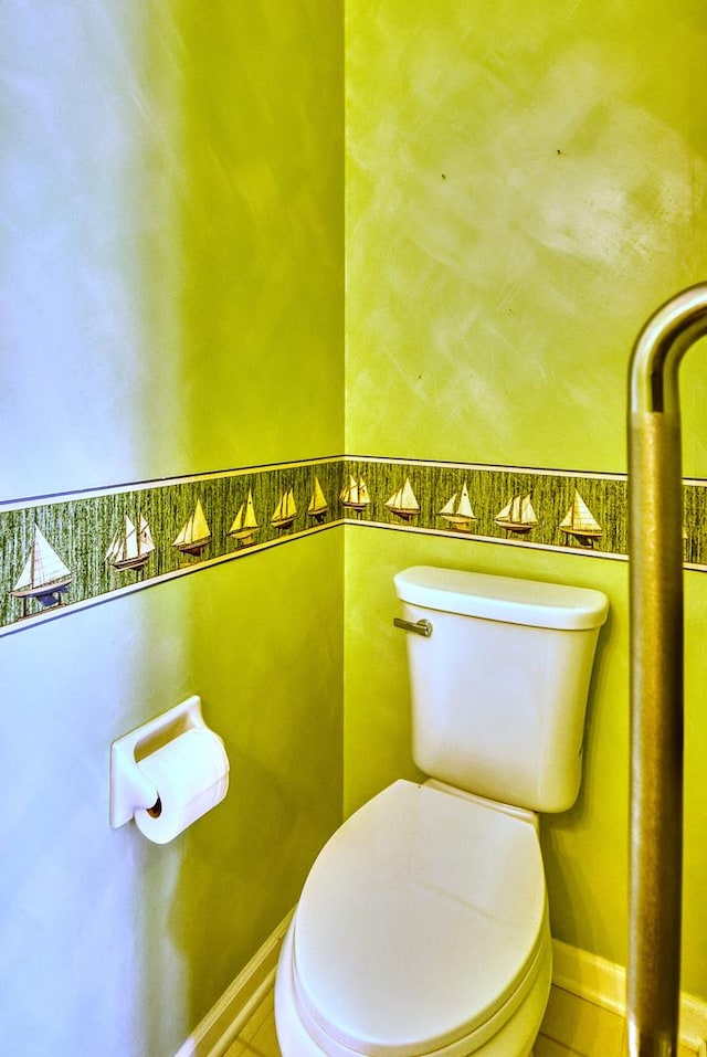 bathroom featuring tile patterned floors and toilet