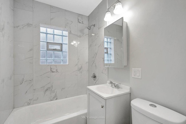 full bathroom featuring  shower combination, a wealth of natural light, vanity, and toilet