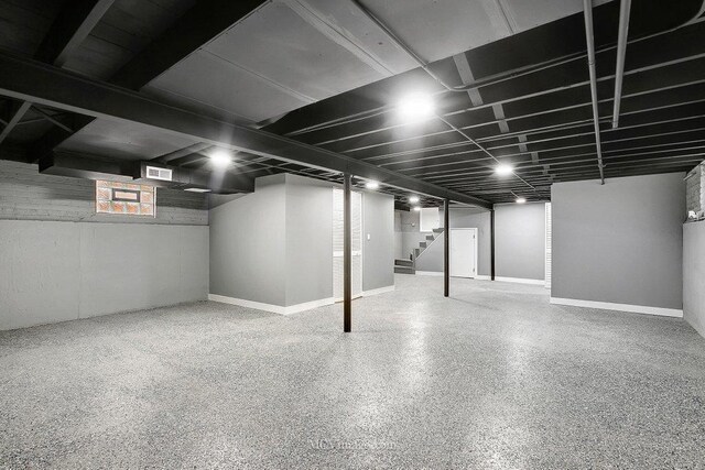 basement with visible vents and stairway