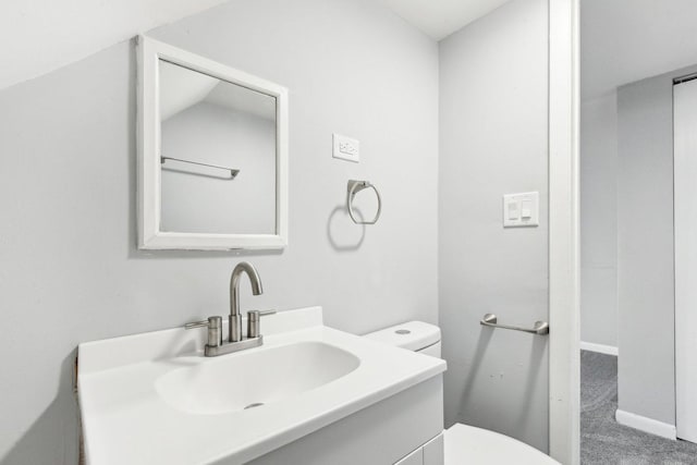 bathroom with toilet and vanity