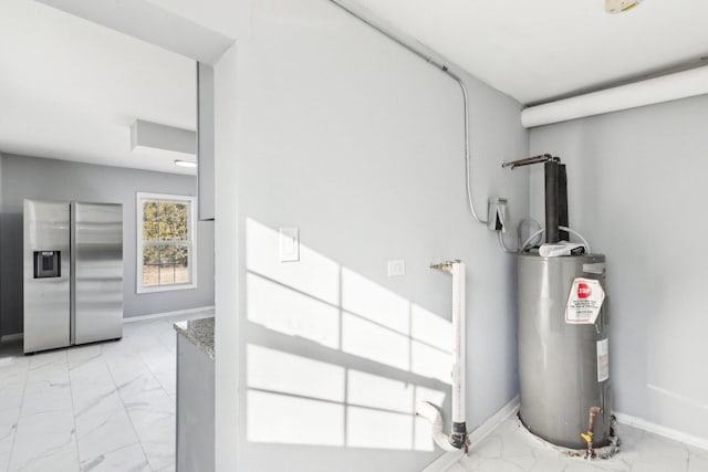 utility room featuring water heater