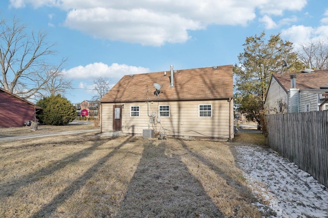 back of house featuring fence