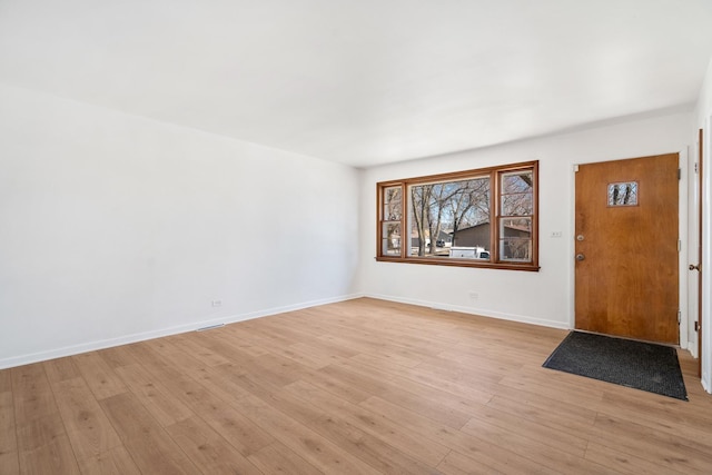 entryway featuring light wood-type flooring and baseboards