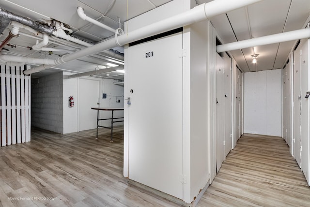 corridor with light wood-style flooring