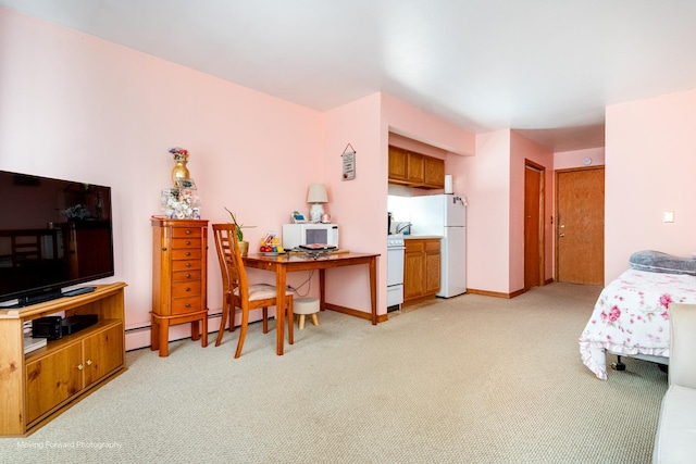 bedroom with light carpet, freestanding refrigerator, and baseboards