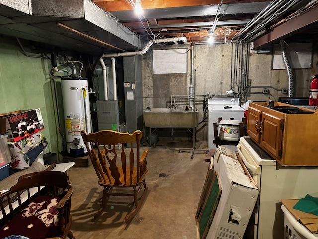 115 N Lavergne Ave, Northlake, IL 60164 - unfinished basement featuring gas water heater, a sink, and heating unit