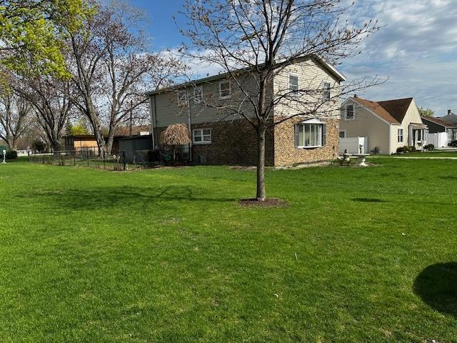 115 N Lavergne Ave, Northlake, IL 60164 - rear view of property featuring a yard