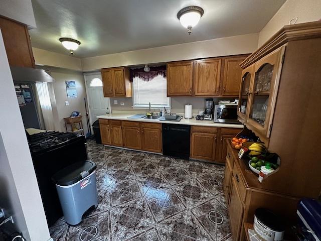 115 N Lavergne Ave, Northlake, IL 60164 - kitchen featuring dishwasher, brown cabinets, stainless steel microwave, and a sink