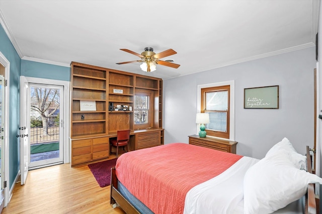 bedroom featuring light wood finished floors, ceiling fan, ornamental molding, built in desk, and access to outside