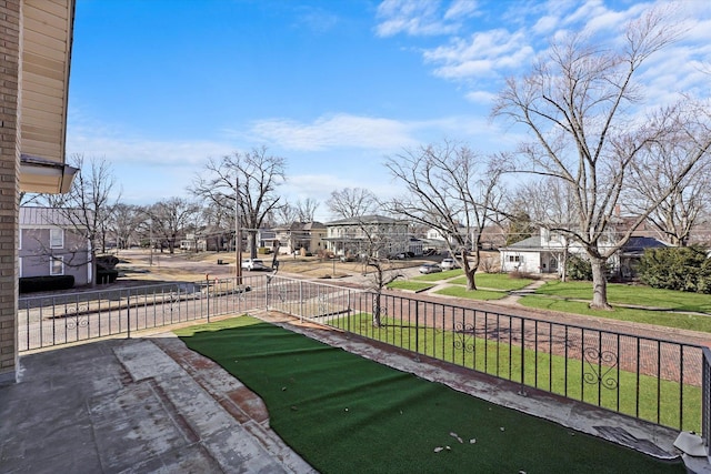 view of yard featuring a residential view and fence