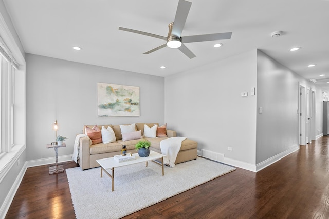 living area with recessed lighting, baseboards, a ceiling fan, and dark wood-style flooring