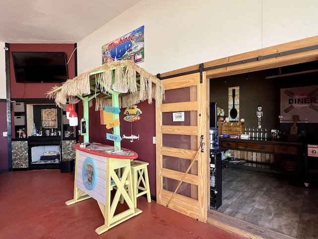 interior space featuring a barn door