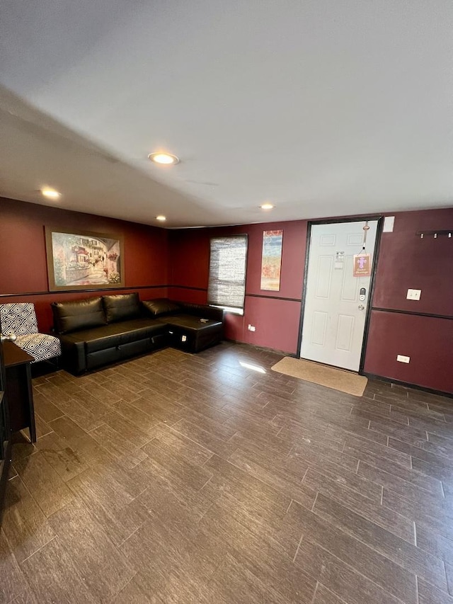 unfurnished living room with recessed lighting and wood finished floors