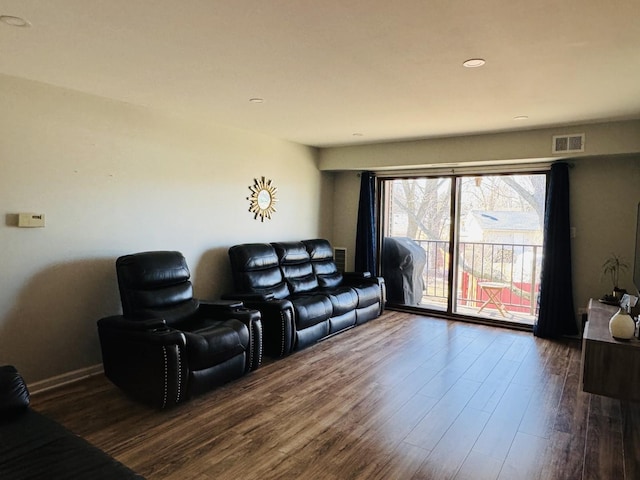 living room with visible vents and dark wood finished floors