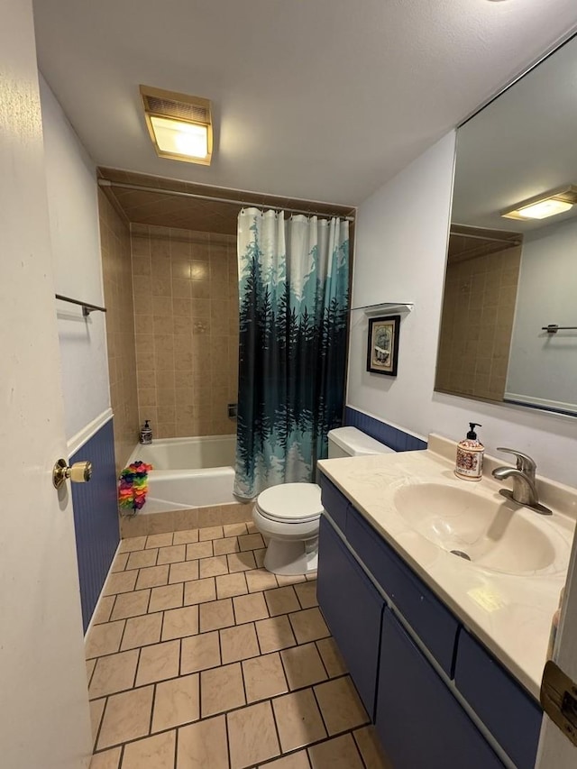 full bathroom with tile patterned floors, toilet, shower / bath combo, and vanity