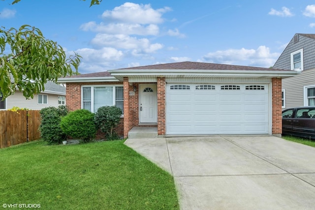 view of front of property featuring brick siding, a front yard, fence, a garage, and driveway