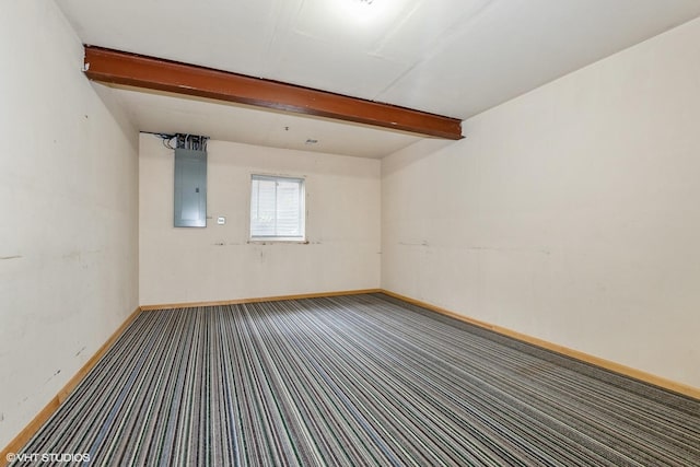 unfurnished room with beamed ceiling, carpet flooring, electric panel, and baseboards