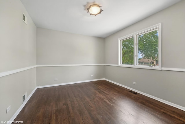 unfurnished room featuring visible vents and baseboards