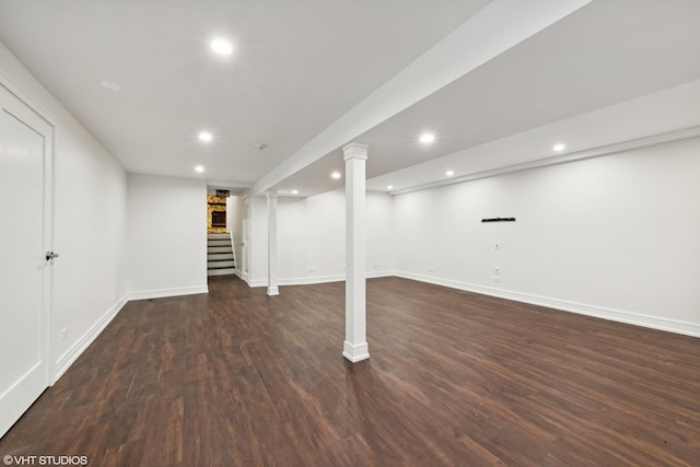 finished basement featuring stairs, baseboards, wood finished floors, and recessed lighting