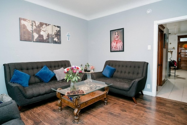 living room featuring baseboards and wood finished floors