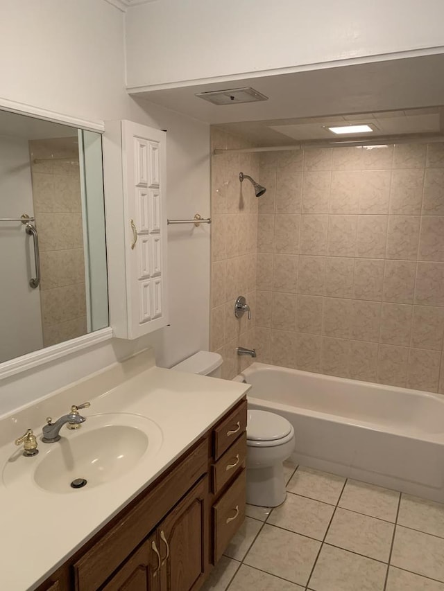 bathroom with visible vents, toilet, washtub / shower combination, vanity, and tile patterned floors