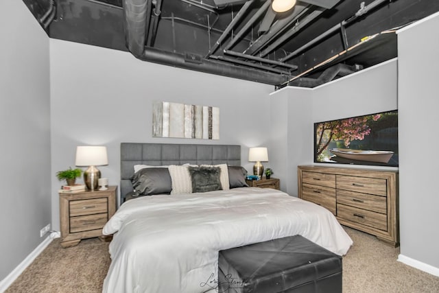 bedroom with carpet flooring and baseboards