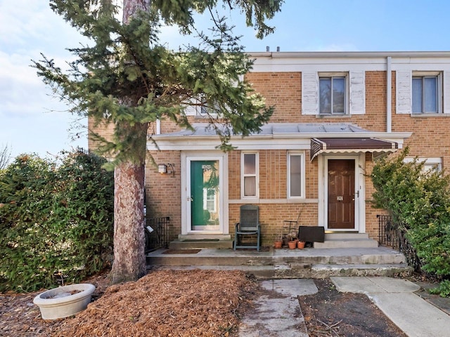 view of front of home with brick siding