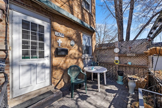 wooden deck featuring a patio area and fence