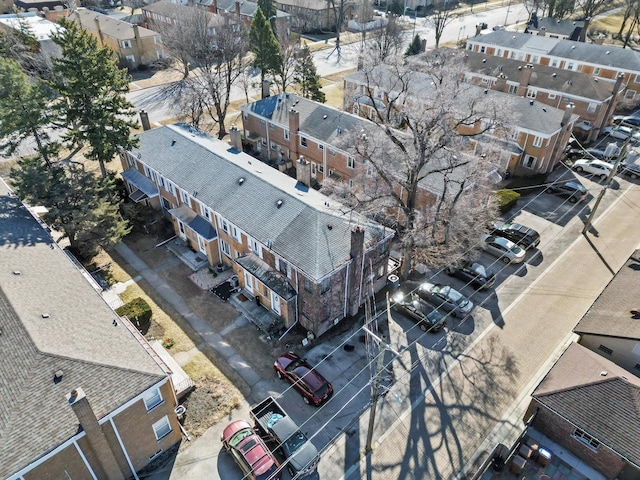 birds eye view of property with a residential view