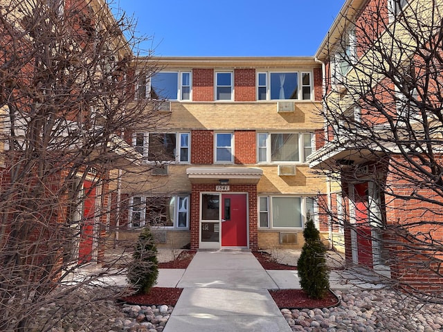 view of front of house featuring brick siding