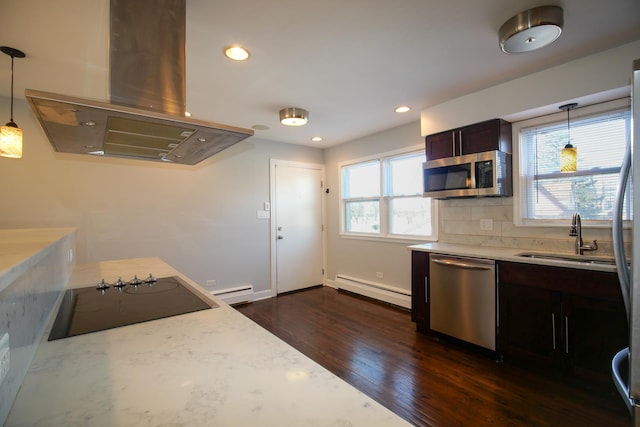 kitchen featuring island exhaust hood, a sink, stainless steel appliances, baseboard heating, and dark wood-style flooring