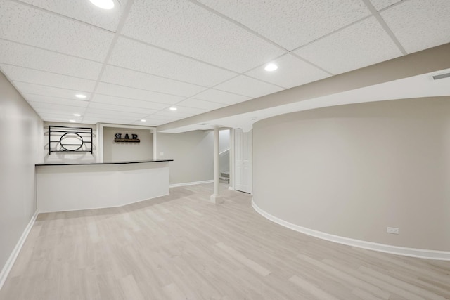 bar with recessed lighting, a drop ceiling, baseboards, and wood finished floors