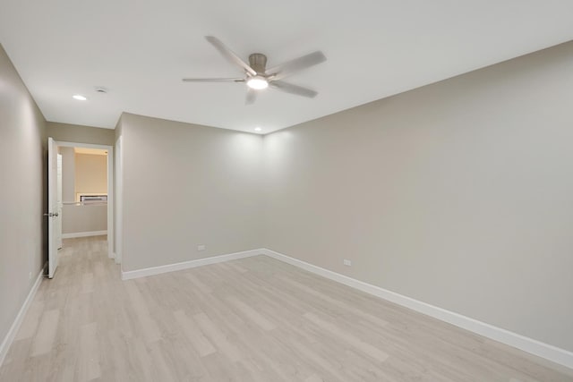 spare room with light wood-style flooring, baseboards, a ceiling fan, and recessed lighting