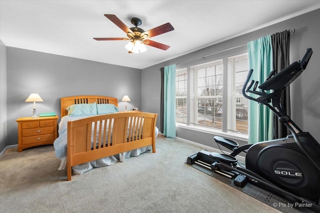 bedroom with carpet, a ceiling fan, and baseboards