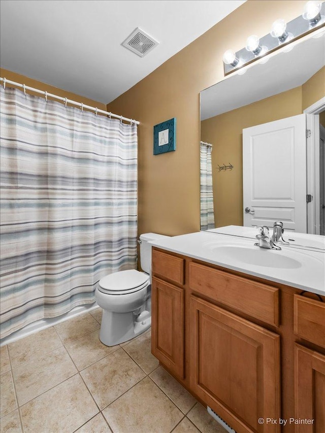 bathroom featuring toilet, tile patterned floors, vanity, visible vents, and a shower with curtain