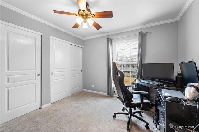 office featuring a ceiling fan, carpet flooring, crown molding, and baseboards