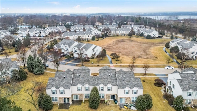 birds eye view of property with a residential view