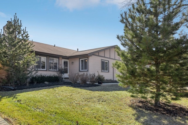 view of front of home featuring board and batten siding and a front yard